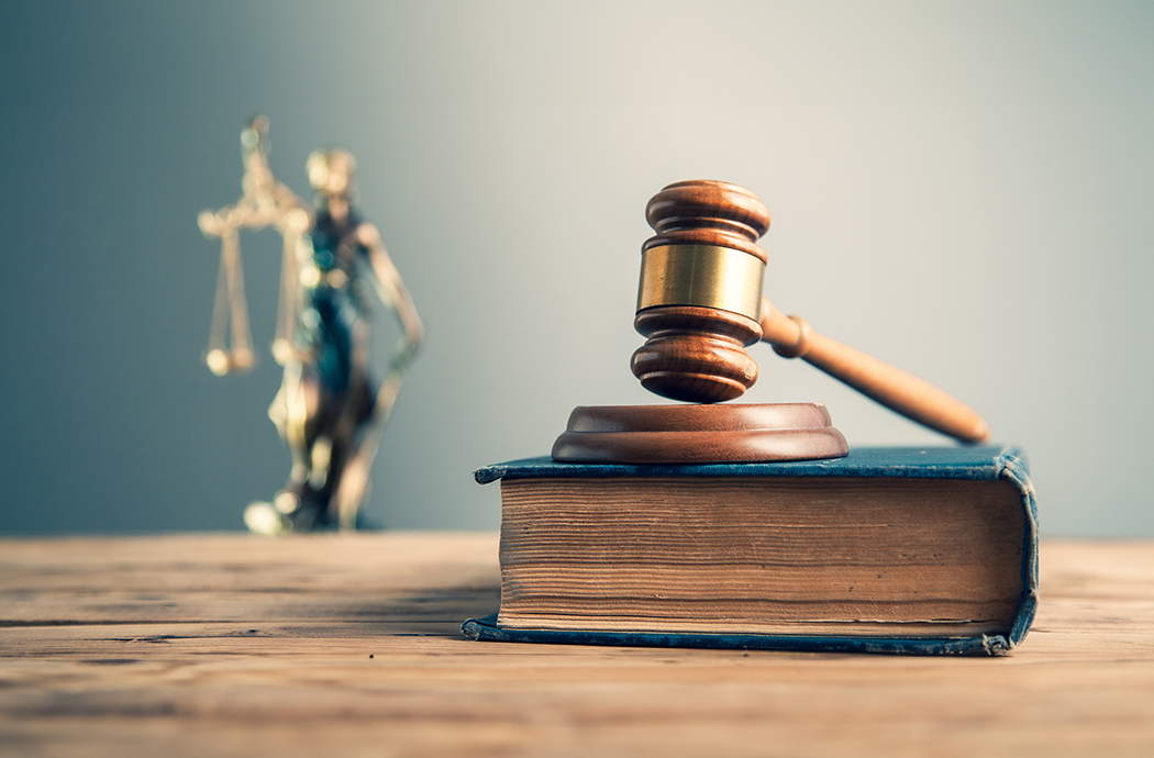 wooden judge on book with justice lady on desk wooden judge on book with justice lady on desk