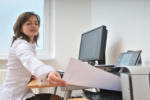 Woman at home office printer